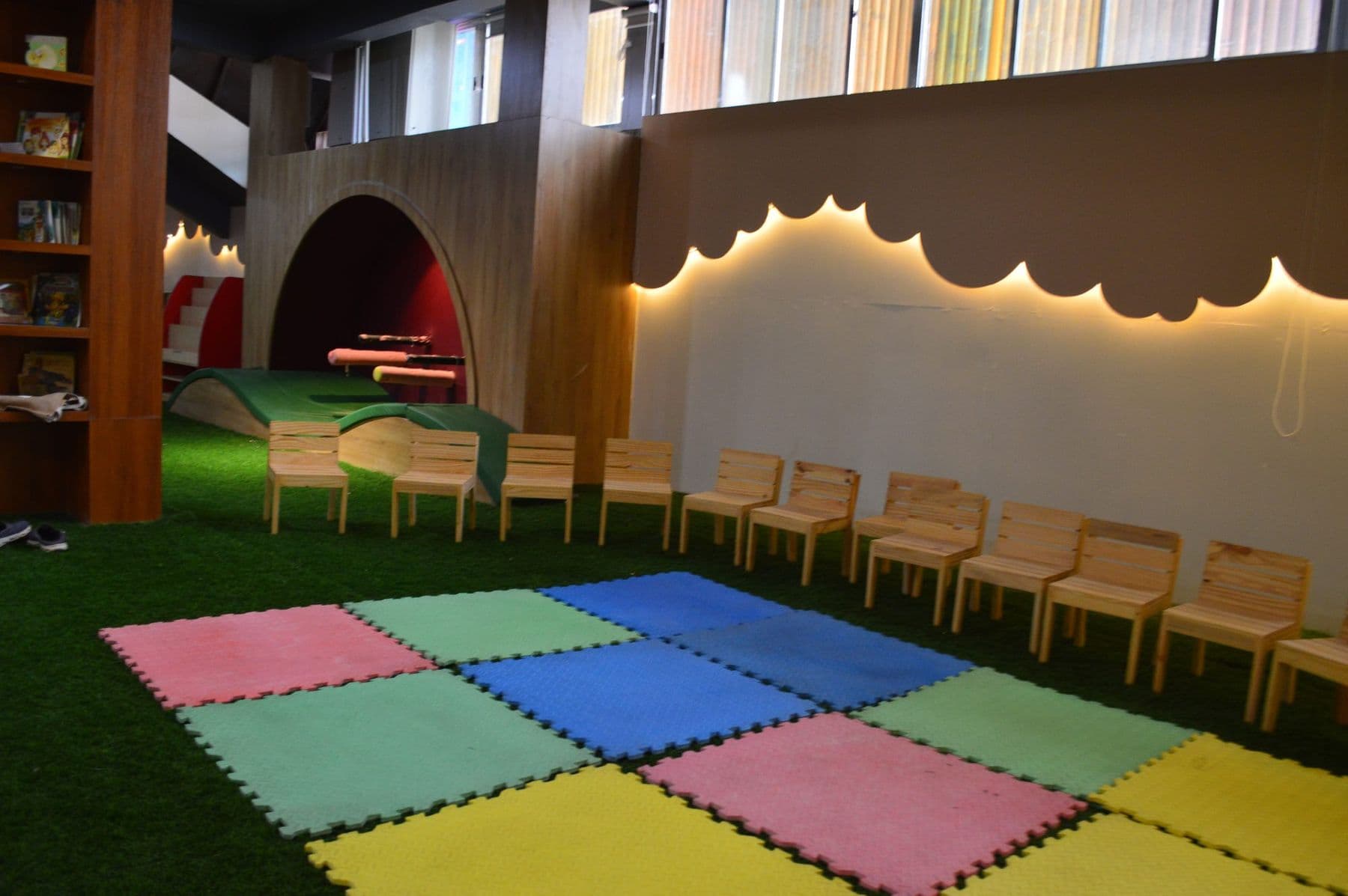 The library hall with colourful mats and little chairs
