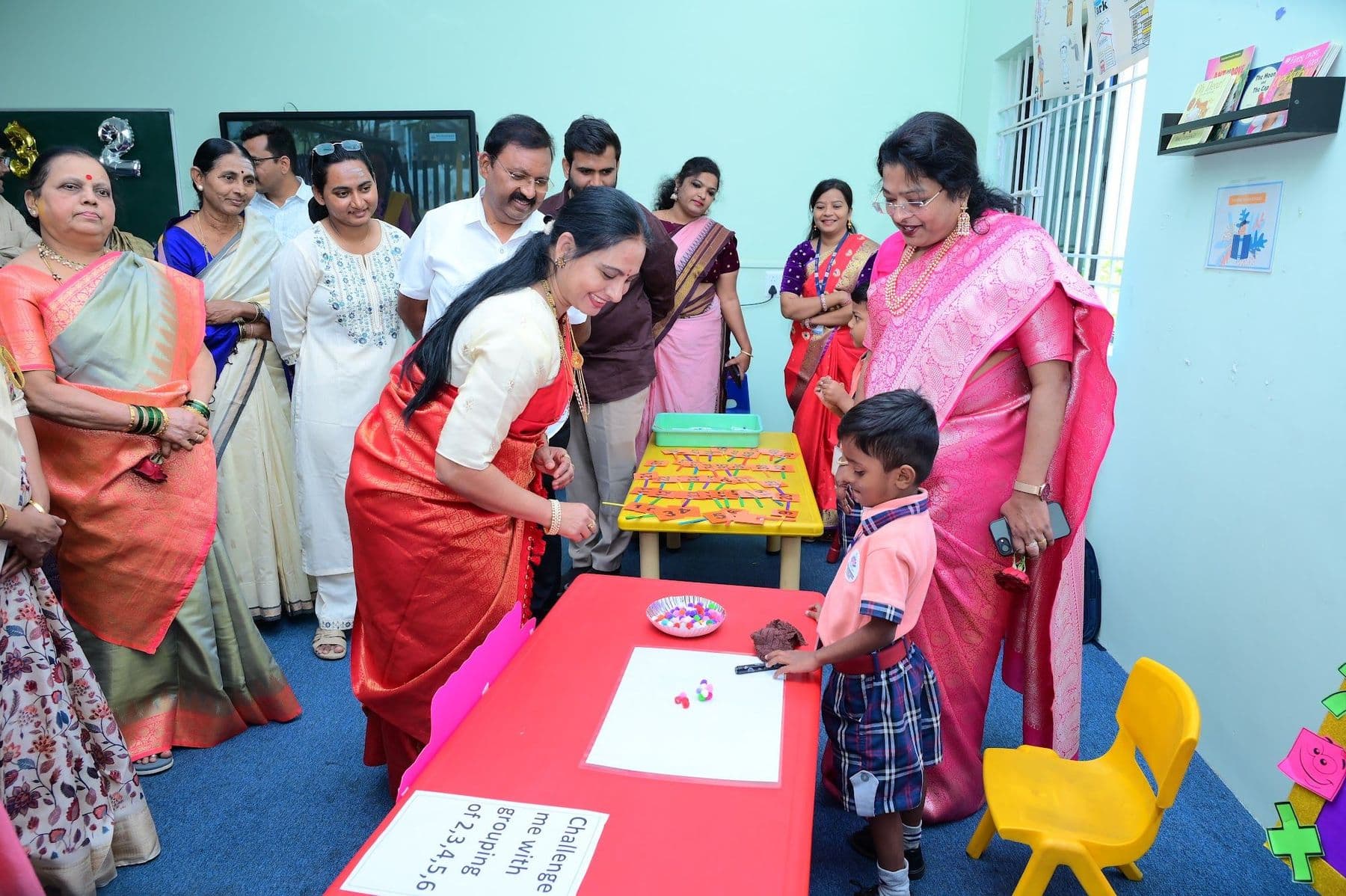 A boy explaining his exhibit to visiting guests