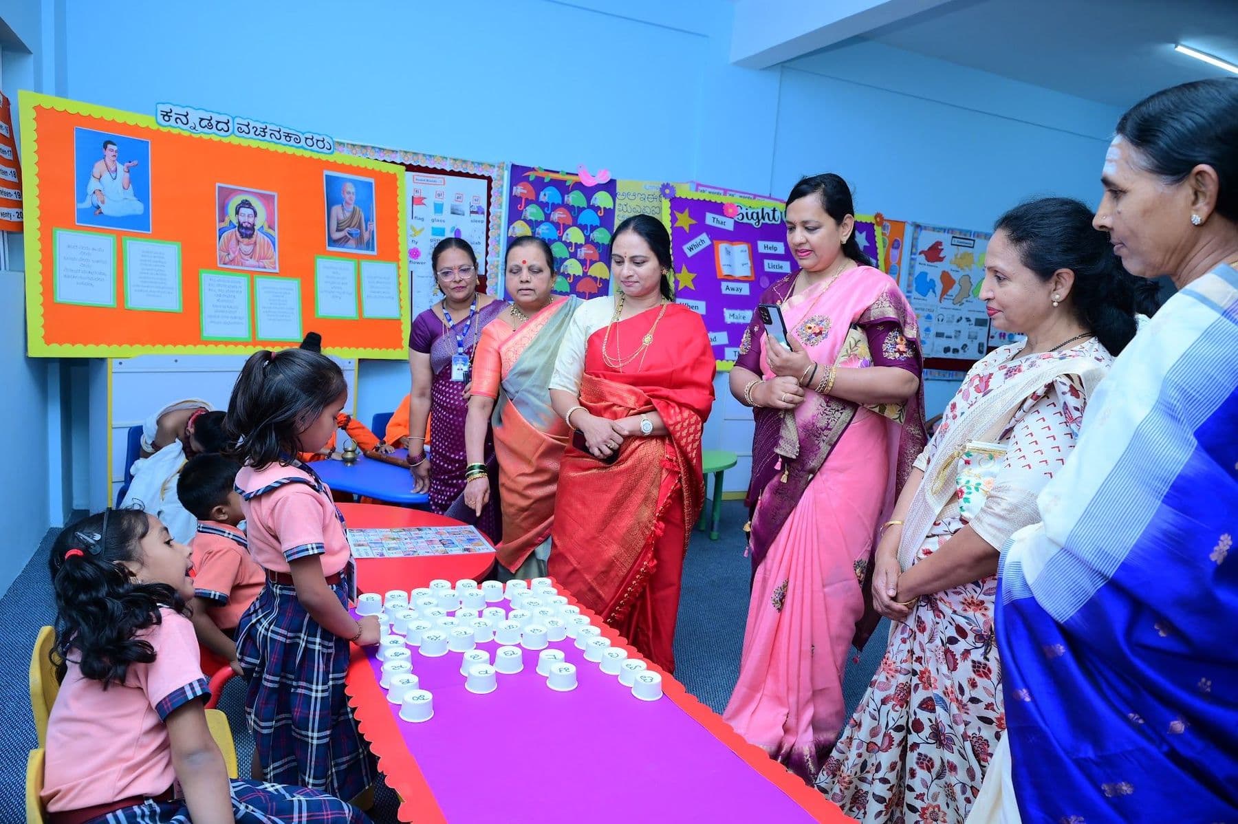 Children showing a counting activity to guests