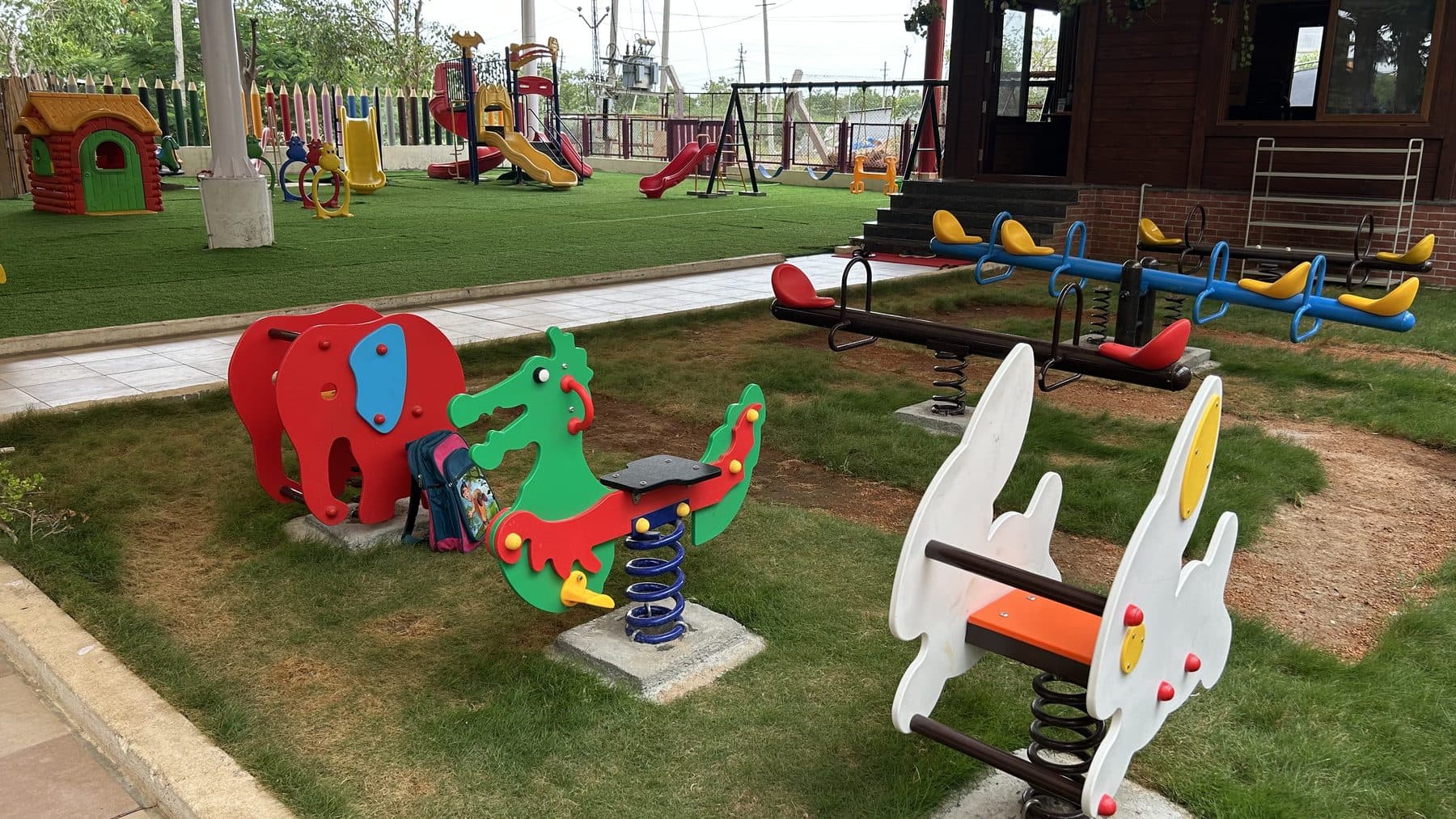 Animal spring riders in the sandy play area