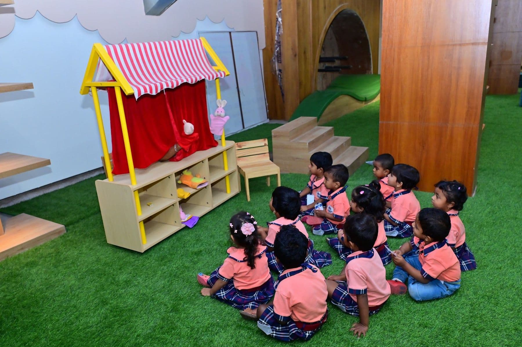 Children watching the puppet theatre