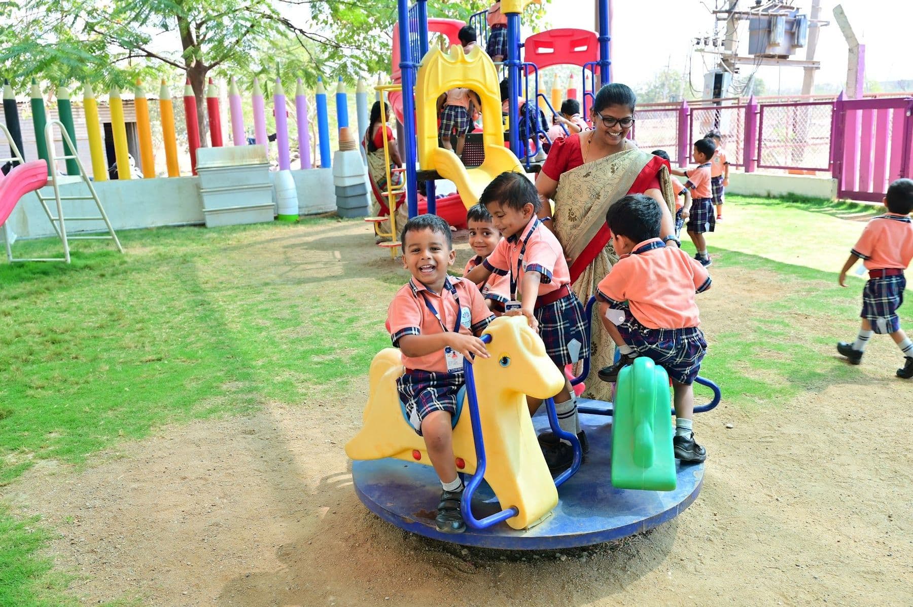Children on a rocking-horse merry-go-round