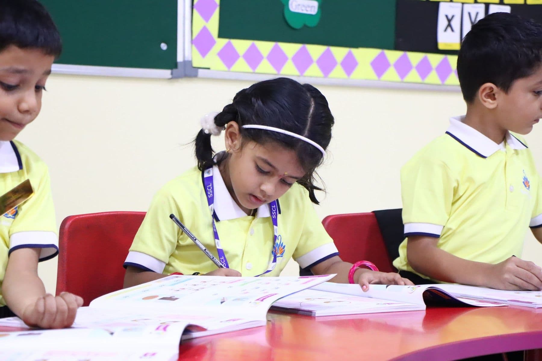 A girl concentrating on her writing