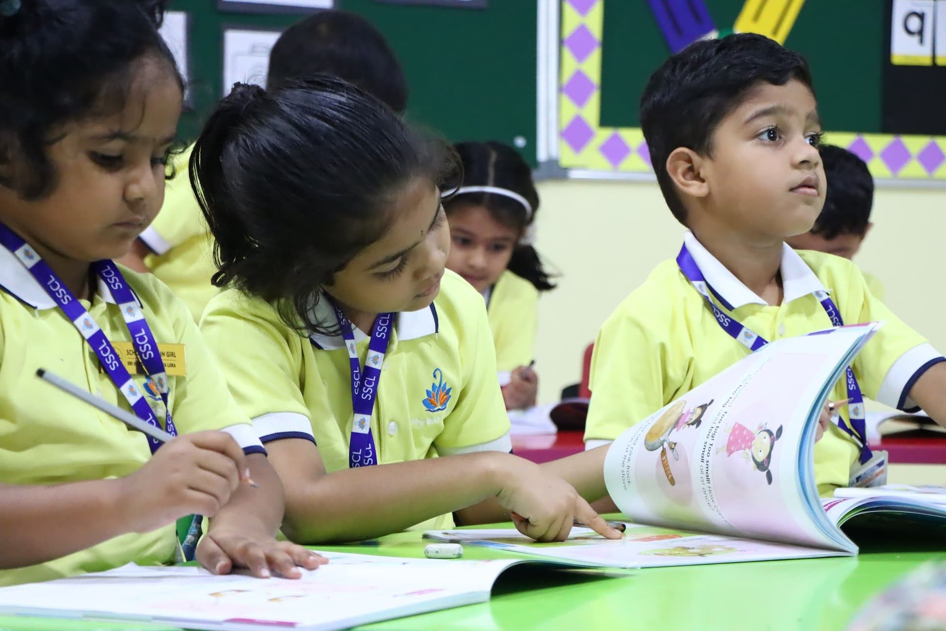 Classmates writing together at their table