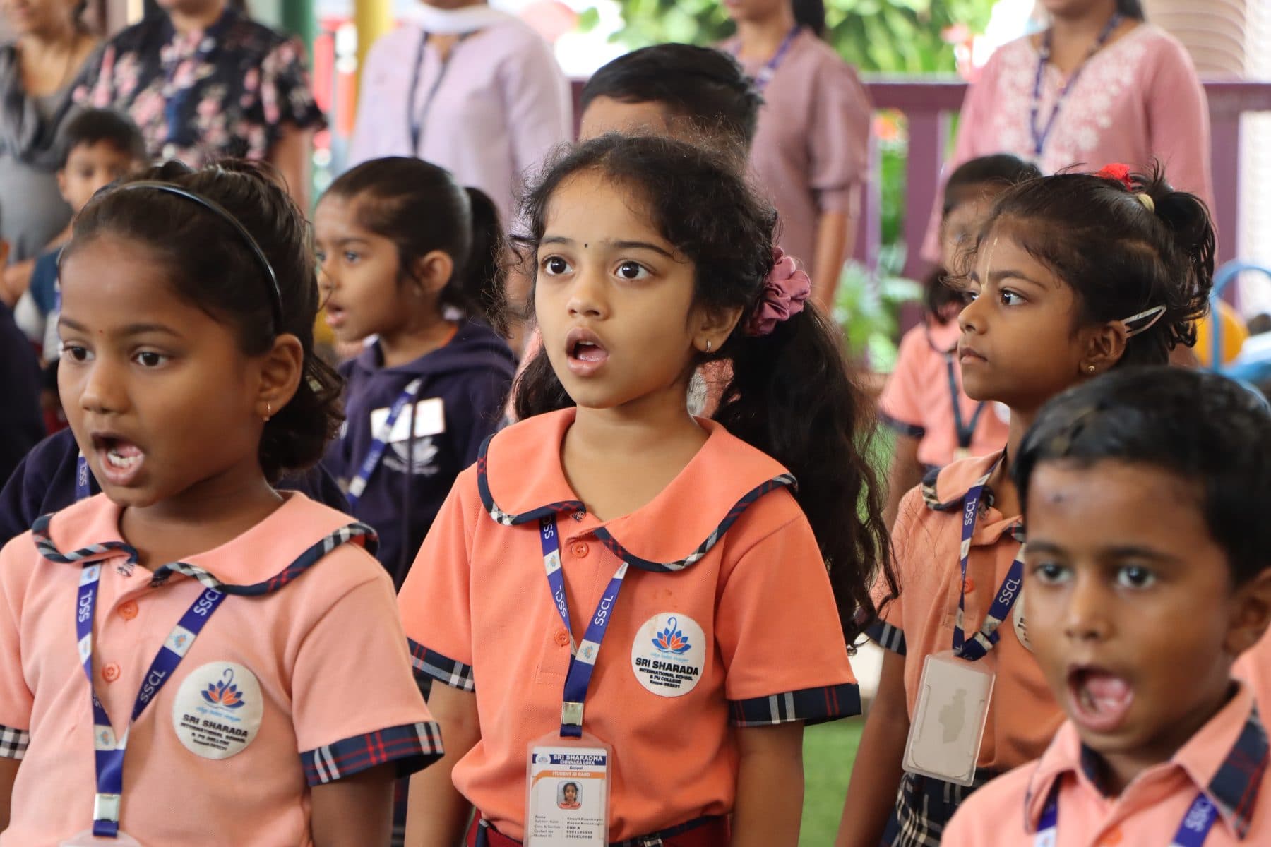 Children singing together at the morning assembly