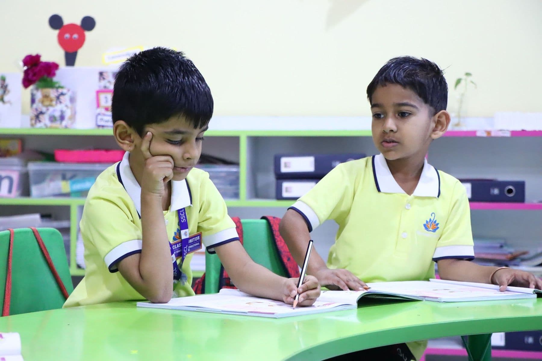 Two boys working on their worksheets